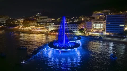 Drone timelapse orbiting Los Muertos pier at night in Puerto Vallarta Mexico Stock Footage 317663705