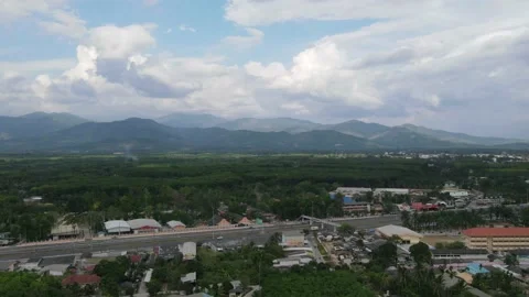 Drone timelapse  - over a town , clouds moving fast Stock Footage 192572379