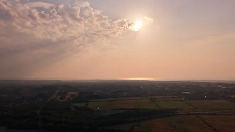 Drone timelapse of partial solar eclipse and sunset, Wirral, UK Stock Footage 345022404