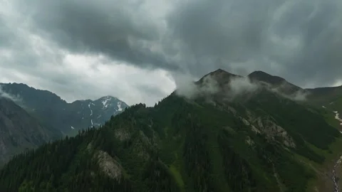 Drone timelapse of storm clouds moving over mountain Stock Footage 341515932