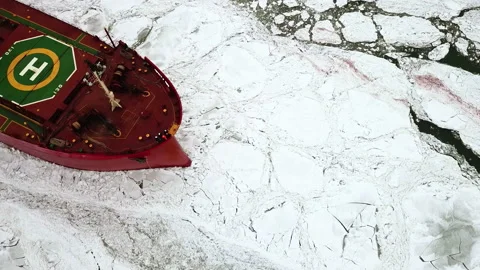 Drone top down Epic red steel icebreaker ship tanker breaks winter frozen sea Stock Footage 165872998