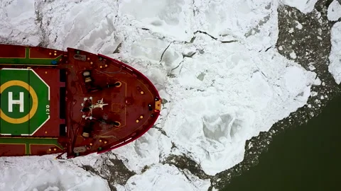 Drone top down Epic red steel icebreaker ship tanker breaks winter frozen sea Stock Footage 165873180