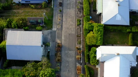 Drone Top Down Going Down World's Steepest Street In Dunedin New Zealand 4K  Stock Footage 234936491