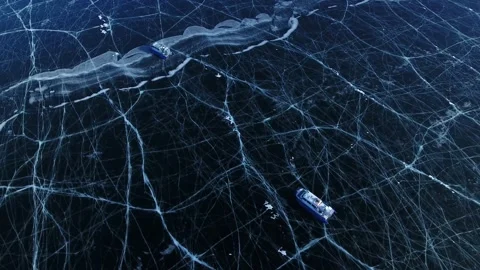 Drone top down hovercrafts, frozen UNESCO world heritage site Lake Baikal Russia Stock Footage 317487295