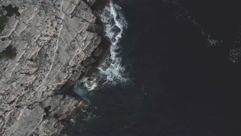 Drone top down moving over rocky beach and waves, Mljet, Croatia Video stock 205385373
