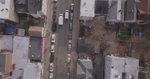 Drone top down moving overhead buildings and cars Stock Footage 99210401