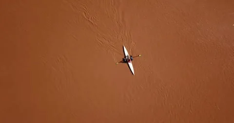 Drone top-down of person kayaking on Itajaí-Açu River, SC Stock Footage 317734465