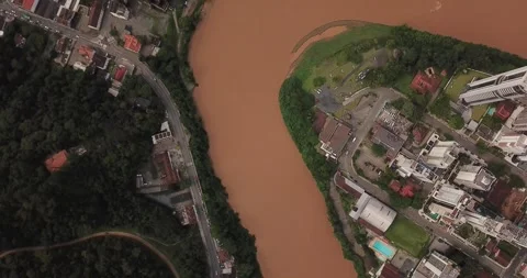 Drone top-down shot of Blumenau city and Itajaí-Açu River, SC Stock Footage 317787976