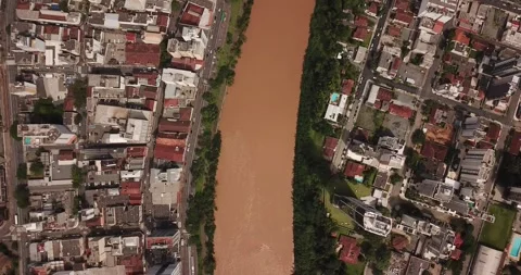 Drone top-down shot of Blumenau city and Itajaí-Açu River, SC Stock Footage 317787987