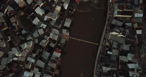 Drone top-down shot of Cachoeiro do Itapemirim city and Itapemirim River, ES Stock Footage 317734695