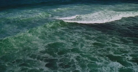 Drone Top Down Shot of Waves Creating Calm Ocean Background Texture Видео 330585440