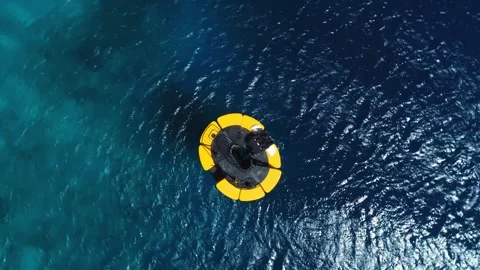 Drone top down shot on yellow mooring bu... | Stock Video | Pond5