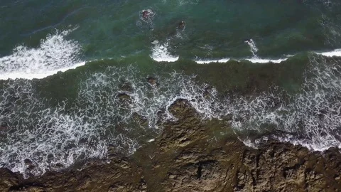 Drone top down stationary view of rocky shorline at Playa Avellana Stock Footage 90920218