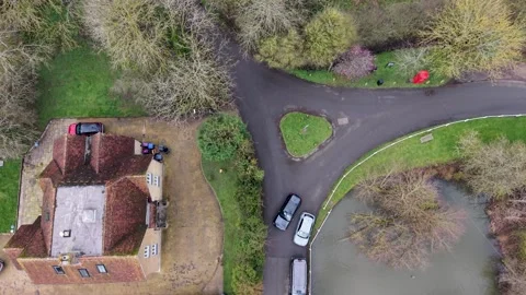 Drone top down of triangular roundabout at Chapmore End with red phone box and Video stock 331461587
