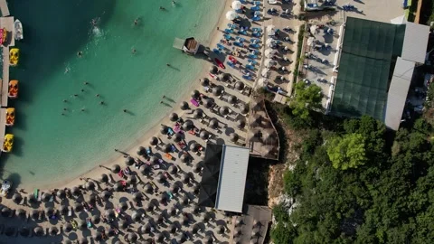 Drone Top Down View of Beach Umbrellas in Ksamil, Albania Stock Footage 316764242