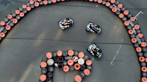 Drone top-down view of curvy turn  on a karting track with carts Stock Footage 170392018