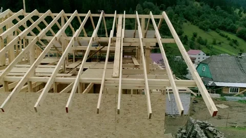 Drone top-down view of detailed wooden house framework with trusses Stock Footage 327866723