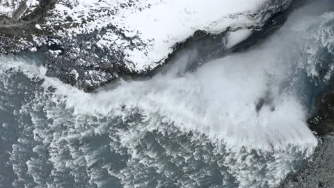 Drone top-down view of Dettifoss Waterfall, Iceland - wide rotating shot Stockbeeldmateriaal 138012430