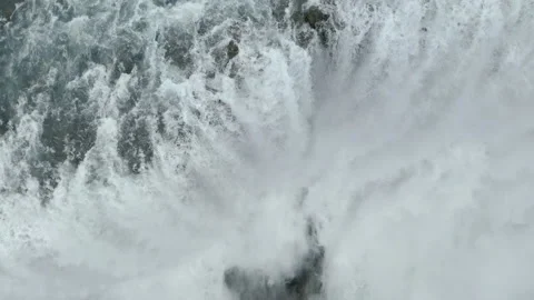 Drone top-down view of Dettifoss Waterfall, Iceland - close-up rotating shot Stockbeeldmateriaal 138013179