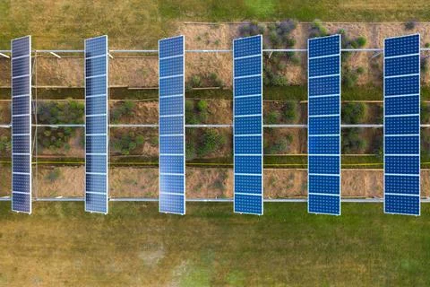 Drone top down view of lavender garden and on top solar panels in line Stock Photos