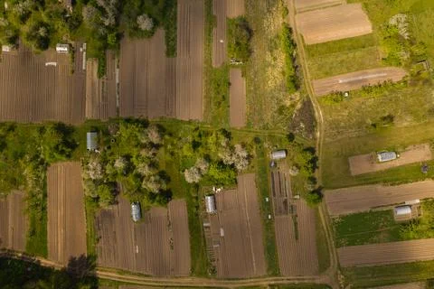 Drone top down view of personal gardens and greenhouses Stock Photos