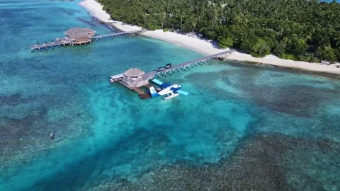 Drone top down view of a Seaplane. Tropical atoll island in Maldives with coral Stock Footage 201063689