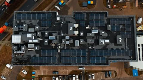 Drone top-down view of solar panels on modern residential building, Poznań Stock Photos