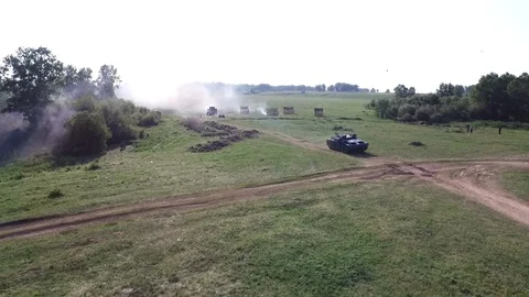 Drone top reconstruction World War with military soldier on destroyed tank smoke Stock Footage 119730103