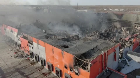 Drone top shot of burnt down warehouse with smoke clouds. Stock Footage 210108575