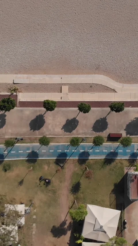 Drone Top Shot Flying Sideways over Modern Promenade on Mediterranean Coast Stock Footage 317992560