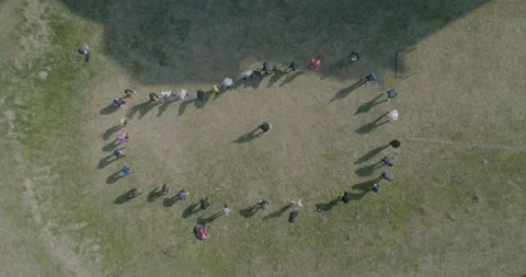 Drone top shot of people doing gymnastics Stock Footage 188103545