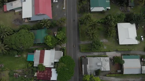 Drone top shot view above exotic road with cars and buildings in Cook Islands. Stock-Footage 211710469