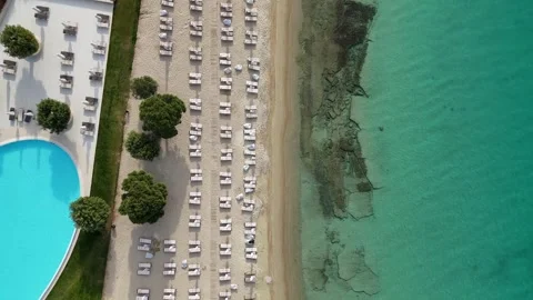 Drone top view of beachfront resort pool and sandy beach, Halkidiki Stock Footage 327790190