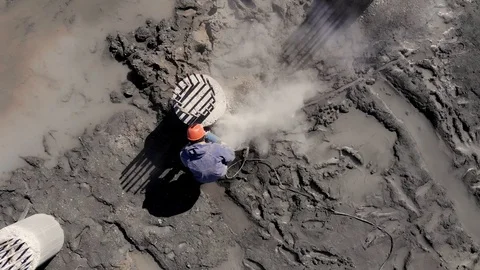 Drone top view builder plumes concrete piles at construction site. Video stock 105207634