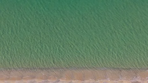 Drone top view of calm green sea surface with rippling texture Stock Footage 321966610