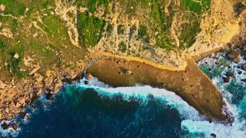 Drone top view of  coast line. Waves, sea, rocks, cliffs Stock Footage 329373348