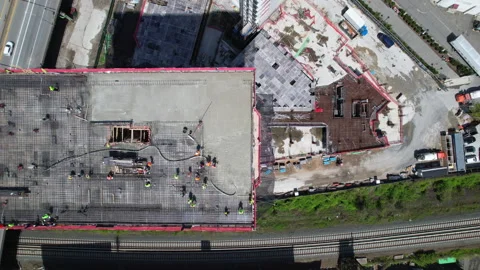 Drone top view of Construction workers and highway. Progres build. 4K Video stock 233589216