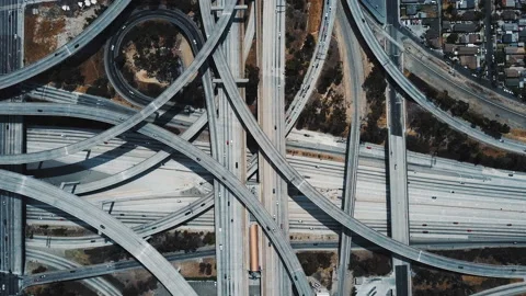 Drone top view of epic highway junction interchange with traffic moving through Stock-Footage 97335477