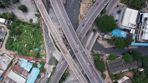 Drone top view of intersecting flyovers and bridges with busy traffic shows.. Stock Footage 344878658