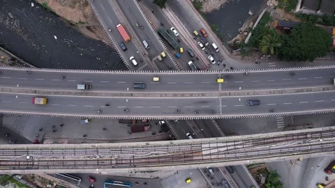 Drone top view of intersecting flyovers and bridges with busy traffic shows.. Stock-Footage 344878680