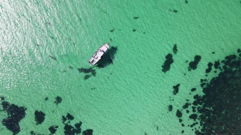 Drone top view of lonely boat in turquoise crystal ocean water. Stock Footage 337226321