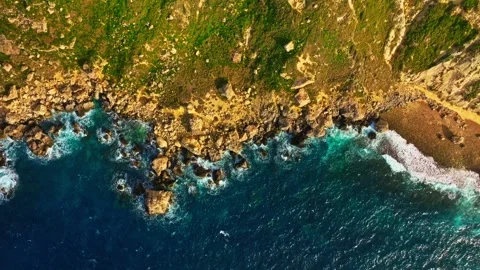 Drone top view of Maltese coast line. Waves, sea, rocks, cliffs Stock Footage 329373211
