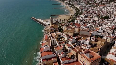 Drone top view of old town and beach breakwaters, Sitges, Spain. Stock Footage 319944447