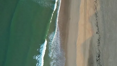 Drone top view of people walking on ocean beach Stock Footage 294700938