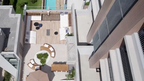 Drone top view of a pool area in a residencial building Video stock 339979327