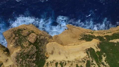 Drone top view of rocks and waves. Mediterranean sea, Malta Stock Footage 305711411