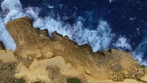 Drone top view of rocks and big waves. Mediterranean sea, Malta Stock Footage 305754963