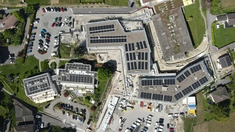 Drone top view solar panels rooftop Switzerland renewable energy Video stock 333226002
