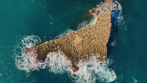 Drone top view of stone rock in the sea, waves and coastline. Mediterranean sea Stock Footage 327154630