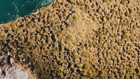 Drone top view of stone rock in the sea, waves. Mediterranean sea Vídeos de archivo 327155552